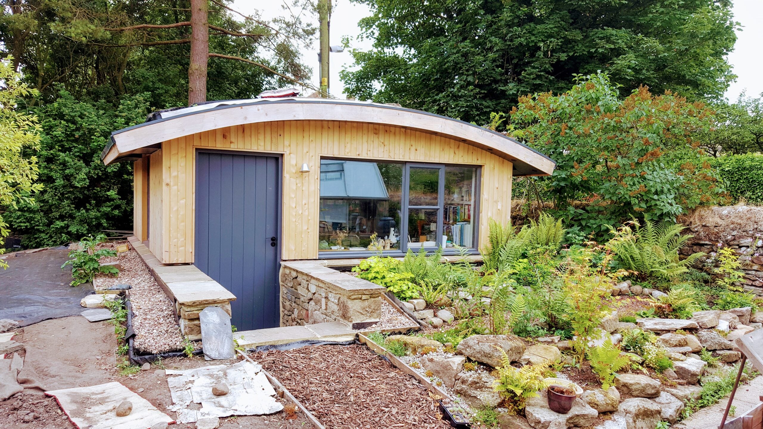 A Hobbit themed garden house with air conditioning unit installed